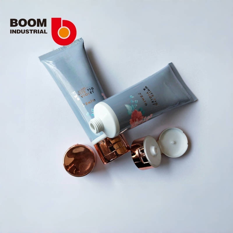 35mm diameter tube with offset printing + hot stamping and electroplated rose gold-colored flip cap